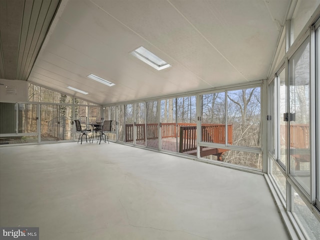 unfurnished sunroom featuring lofted ceiling