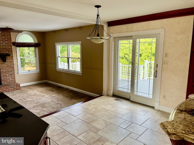 entryway with light carpet, visible vents, and baseboards