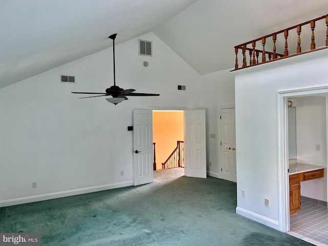 interior space with dark carpet, visible vents, and baseboards