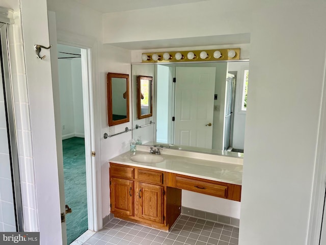 full bathroom with vanity and tile patterned floors