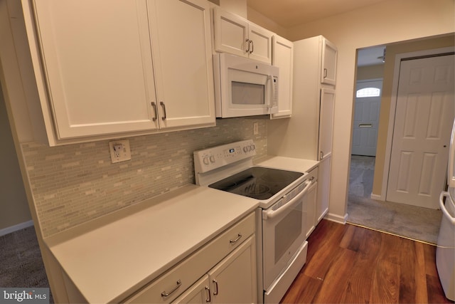 kitchen featuring dark wood finished floors, light countertops, backsplash, white cabinetry, and white appliances