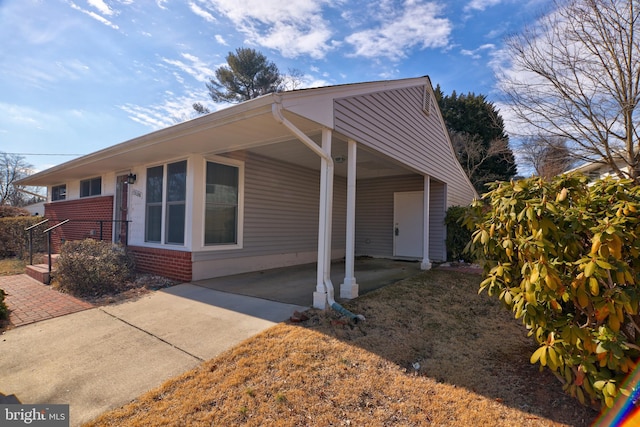 view of side of property with brick siding