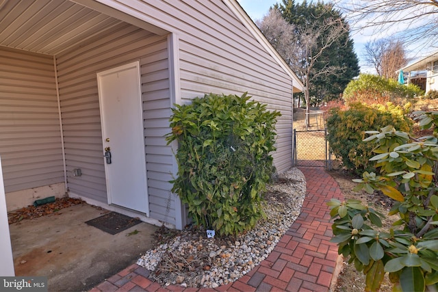 entrance to property featuring fence and a gate