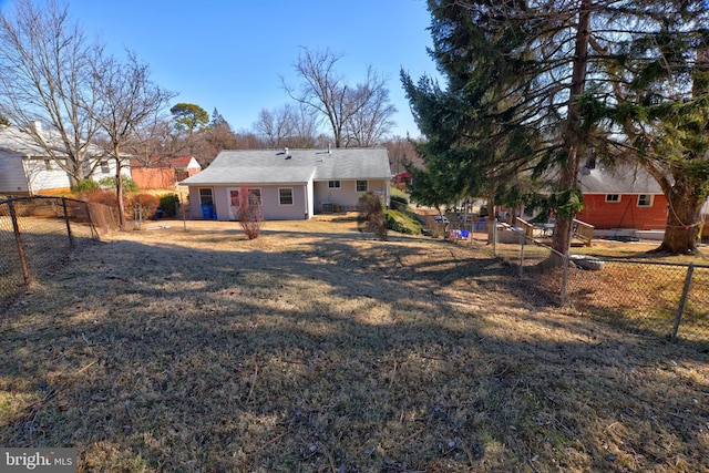 back of property featuring a fenced backyard