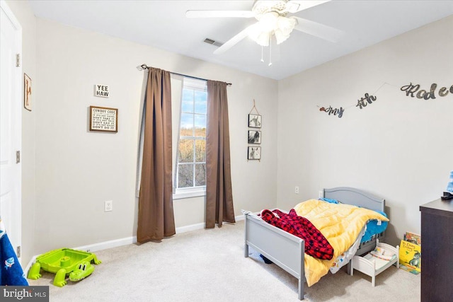 bedroom with visible vents, ceiling fan, light carpet, and baseboards