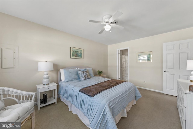 bedroom featuring electric panel, light carpet, ceiling fan, and baseboards