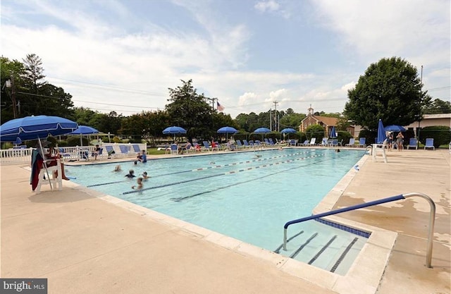 community pool with a patio