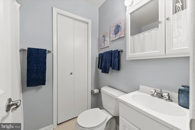 full bathroom with vanity and toilet