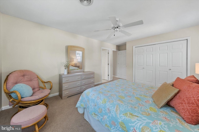 bedroom with light colored carpet, a ceiling fan, baseboards, visible vents, and a closet