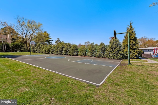 view of basketball court with a yard and community basketball court