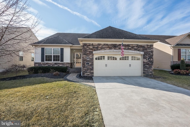 view of front of home with driveway, stone siding, an attached garage, and a front lawn