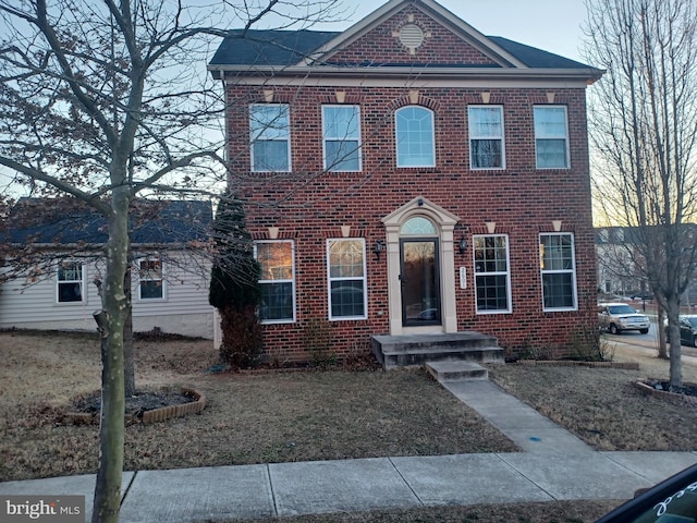 view of front facade featuring brick siding