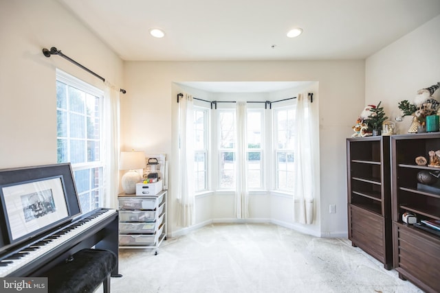 living area featuring recessed lighting, baseboards, and carpet flooring