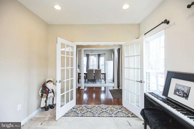 entrance foyer featuring recessed lighting, french doors, baseboards, and decorative columns