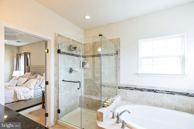 bathroom featuring recessed lighting, a garden tub, ensuite bath, and a stall shower