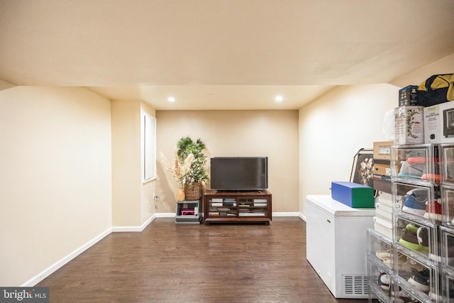 interior space with recessed lighting, baseboards, refrigerator, and dark wood-style floors