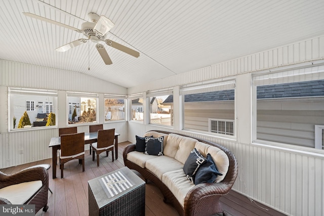 sunroom featuring a ceiling fan and vaulted ceiling