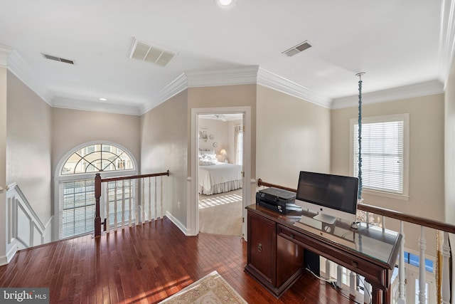 office featuring plenty of natural light, visible vents, and dark wood finished floors