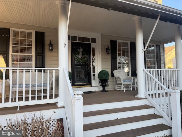 property entrance with covered porch