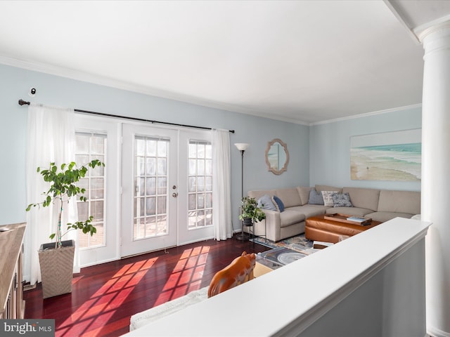 living room featuring french doors, dark wood-style flooring, decorative columns, and crown molding