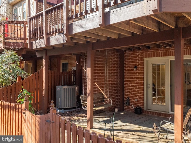 view of patio / terrace featuring cooling unit and fence