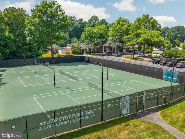 view of sport court with fence