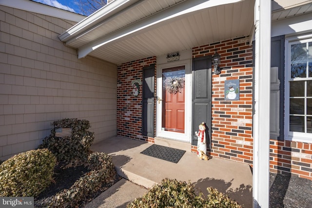 property entrance with brick siding