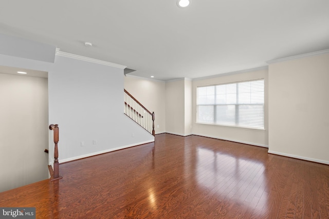 unfurnished living room with crown molding, stairs, baseboards, and dark wood-type flooring