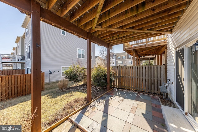 view of patio featuring fence