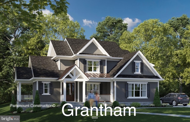 view of front of property with covered porch and a front lawn