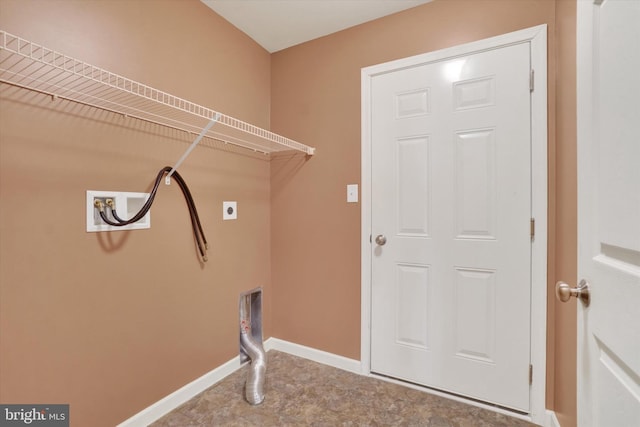 laundry area with baseboards, electric dryer hookup, hookup for a washing machine, and laundry area