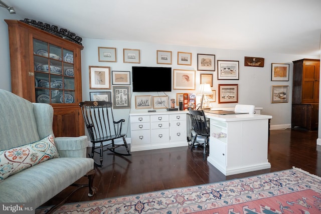 office space featuring dark wood-style floors and baseboards