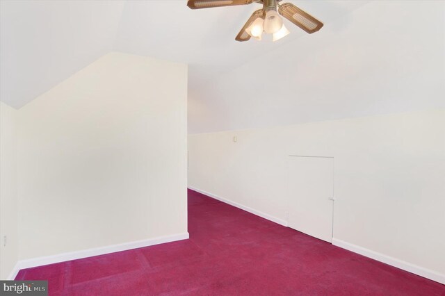 bonus room featuring lofted ceiling, carpet floors, ceiling fan, and baseboards