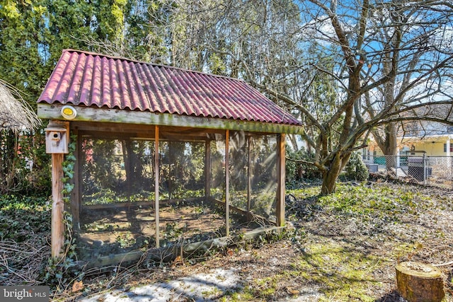 view of yard with an outbuilding and fence