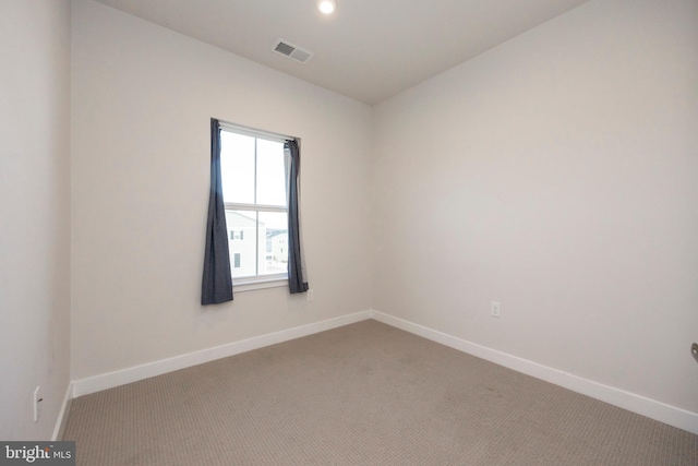 carpeted empty room with recessed lighting, visible vents, and baseboards