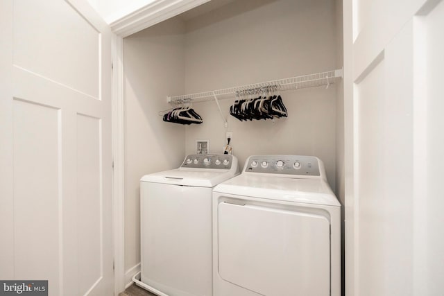 laundry area with washing machine and dryer