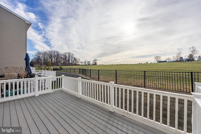 wooden terrace featuring a rural view