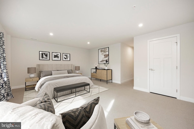 bedroom featuring light carpet, baseboards, and recessed lighting