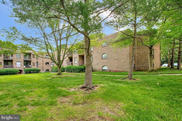 view of home's community with a lawn