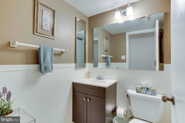 bathroom featuring toilet and vanity