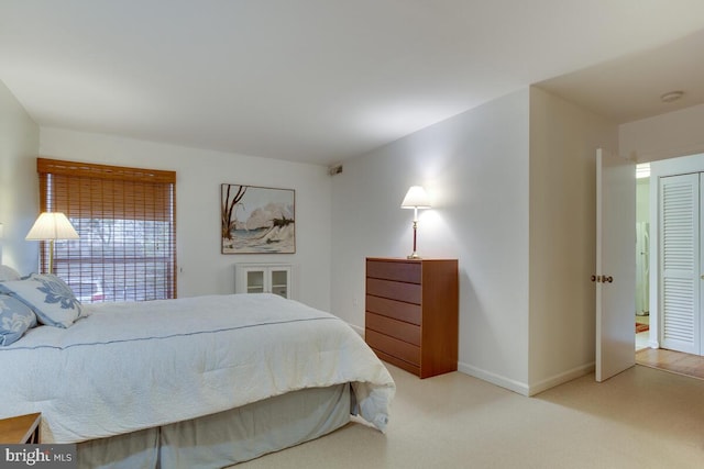 bedroom with carpet flooring and baseboards