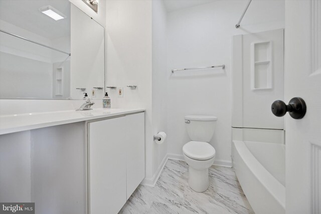 bathroom featuring baseboards, toilet,  shower combination, marble finish floor, and vanity