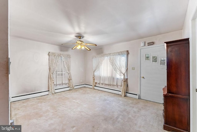 unfurnished room featuring light carpet and ceiling fan