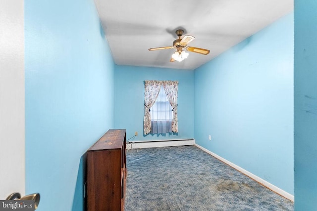 carpeted spare room with ceiling fan, baseboards, and baseboard heating