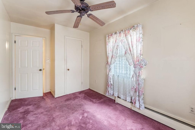 unfurnished bedroom with carpet floors, a baseboard radiator, and ceiling fan