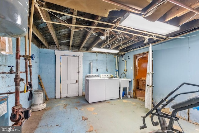 unfinished basement featuring independent washer and dryer