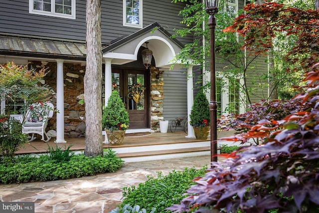 doorway to property with a porch