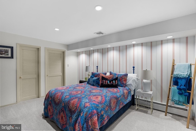 bedroom featuring recessed lighting, visible vents, baseboard heating, and light colored carpet