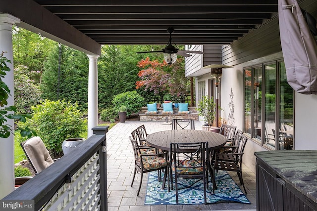 view of patio with a ceiling fan and outdoor dining space