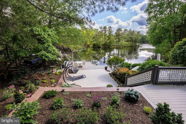 dock area with a deck with water view